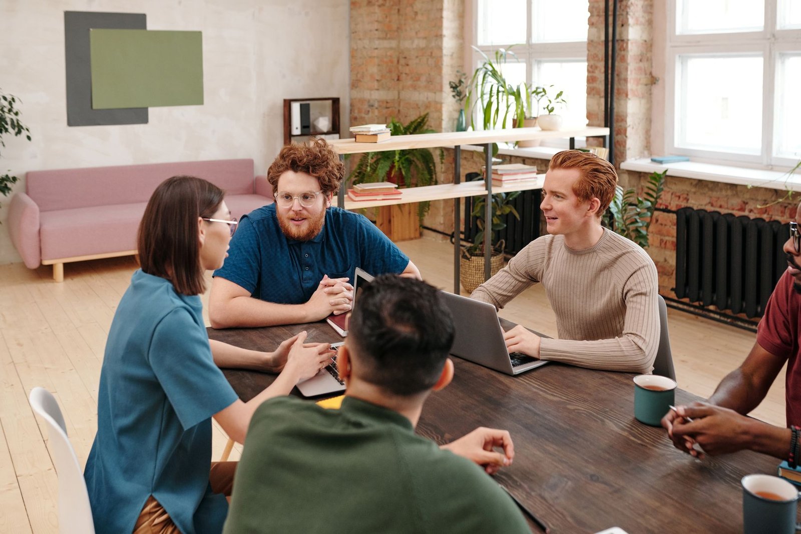 Professional-services team collaborating around a table